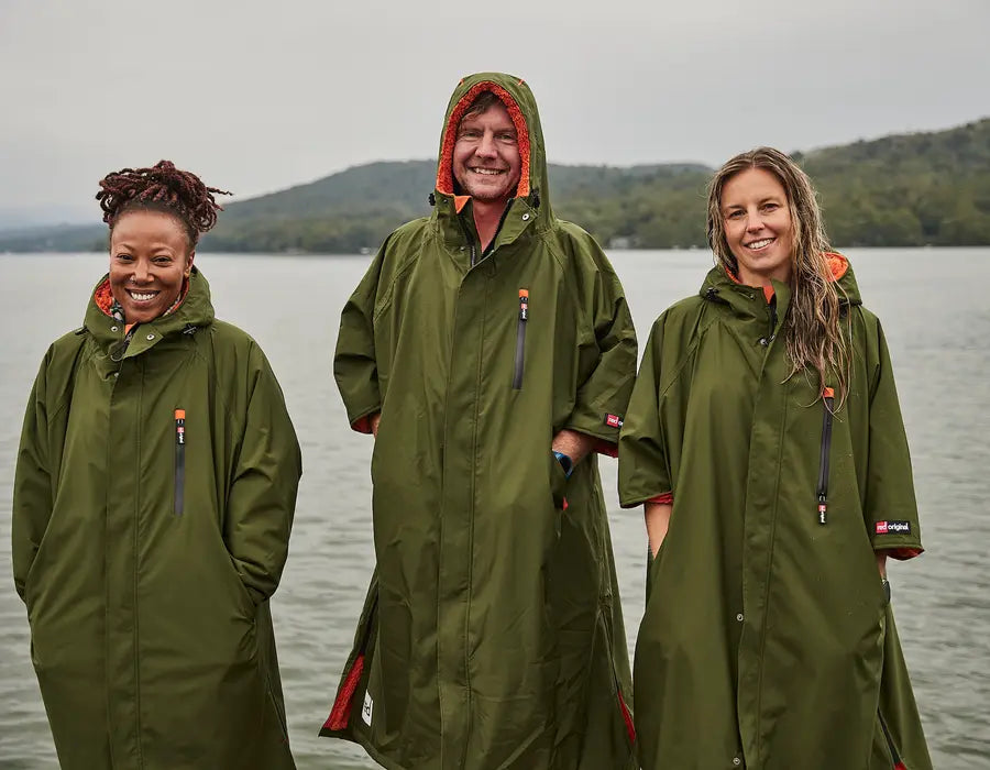 3 people wearing the pro change robe, smiling at the camera