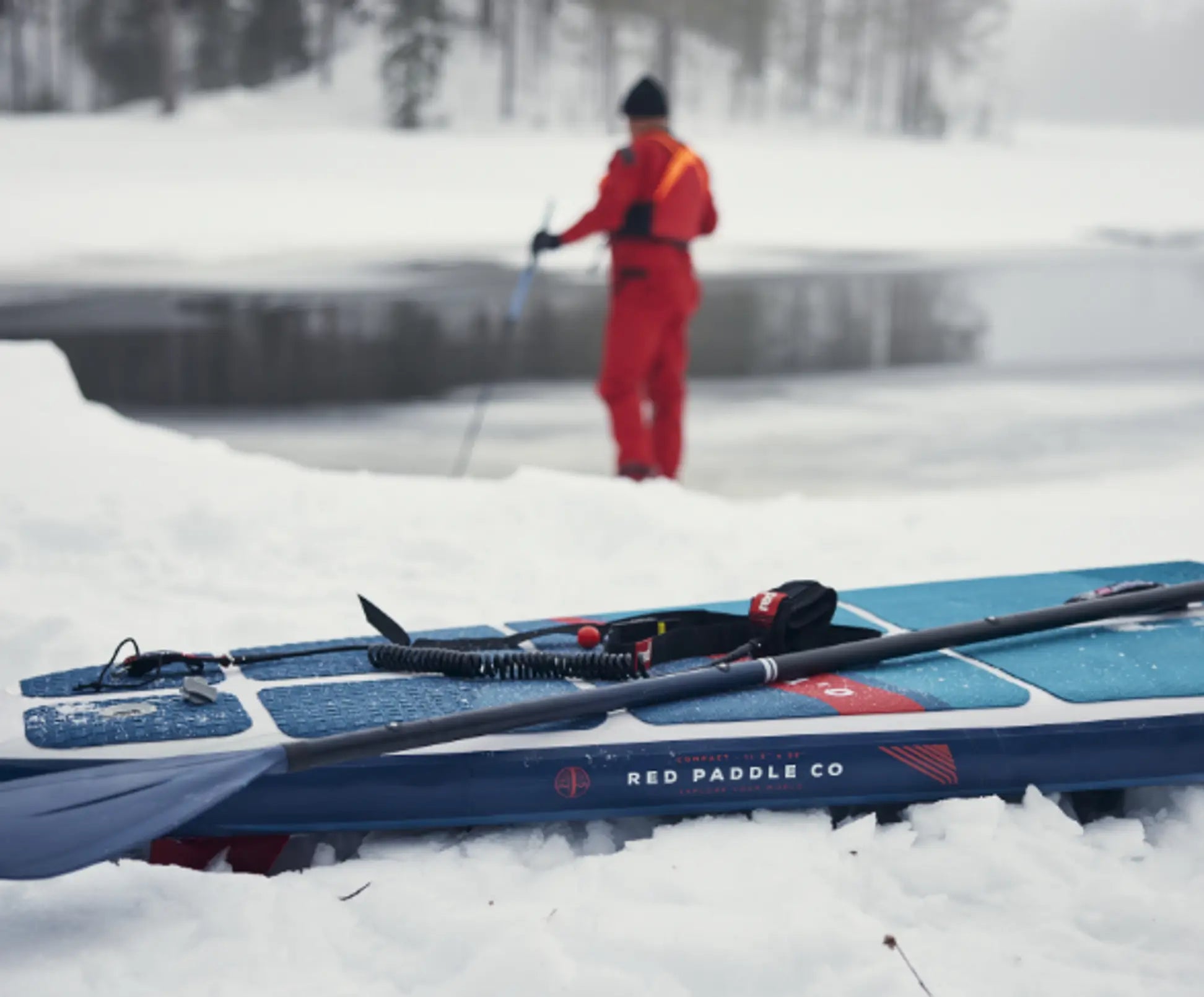 close up of red paddleboard in snow