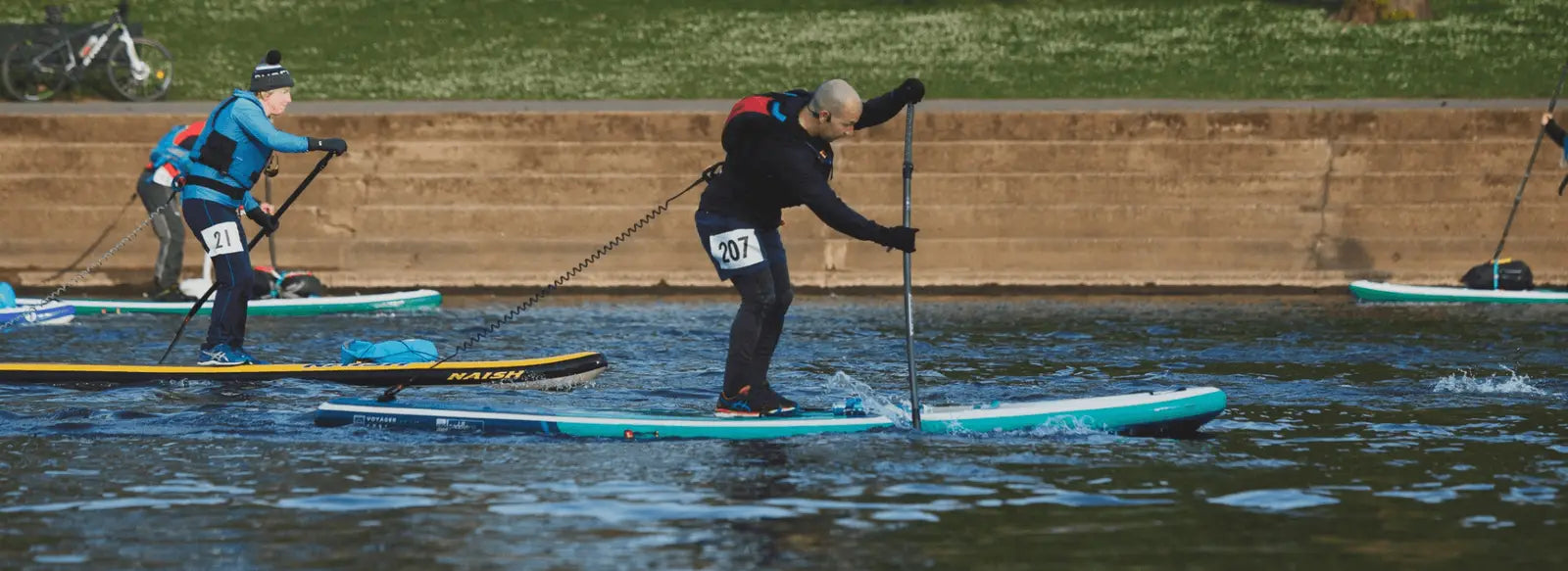 man racing on paddleboard