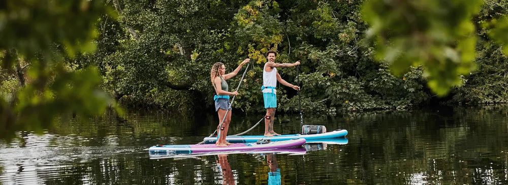 2 people stood up paddleboarding