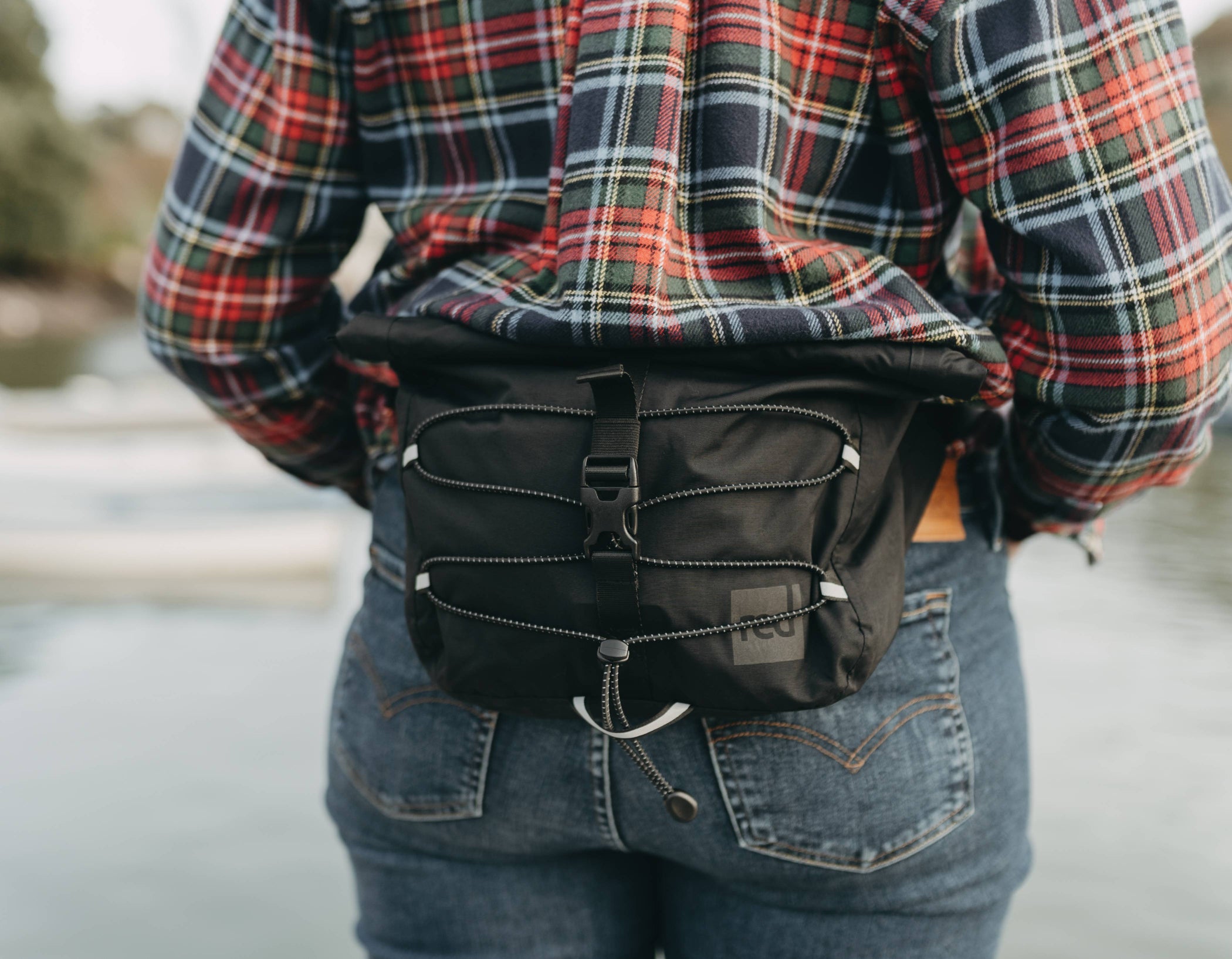 close up of waterproof crossbody bag being worn