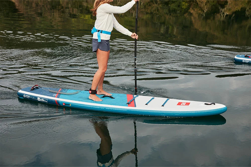 Woman paddling Red Original touring SUP