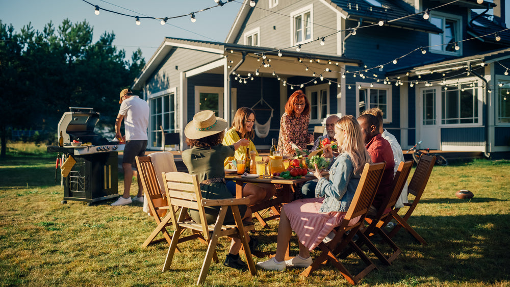 group of people sat outside at a bbq