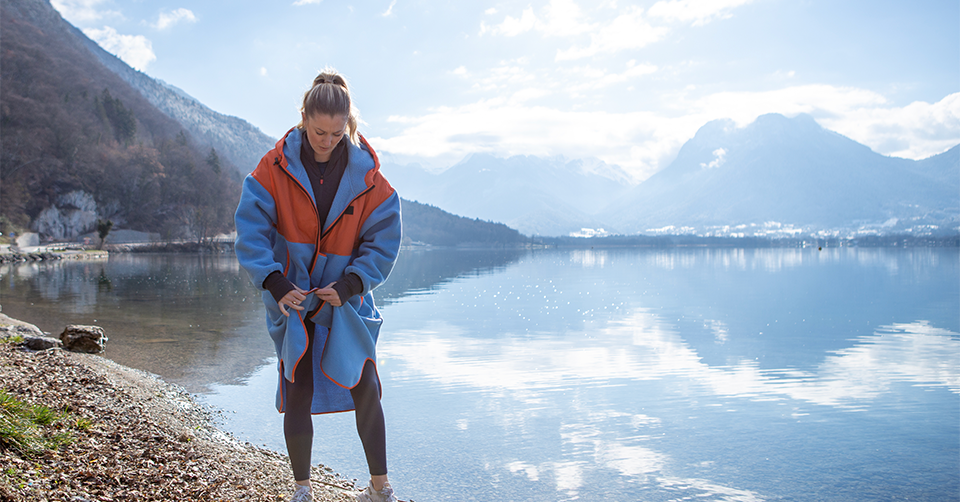 Woman zipping up Red Original Revolution Parka